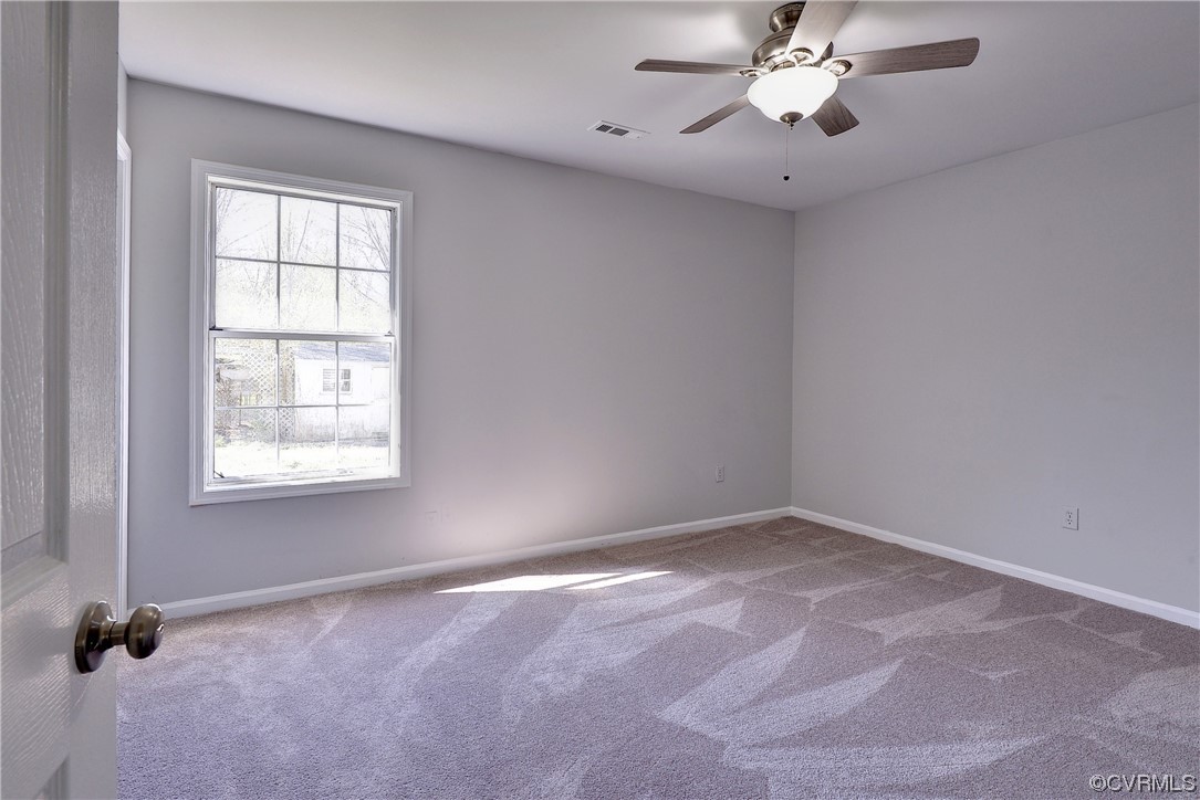 175 Racefield Drive Toano, VA 23168 - Photo 11 of 32 a view of an empty room with a window
