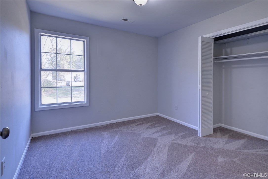 175 Racefield Drive Toano, VA 23168 - Photo 16 of 32 a view of an empty room with a window