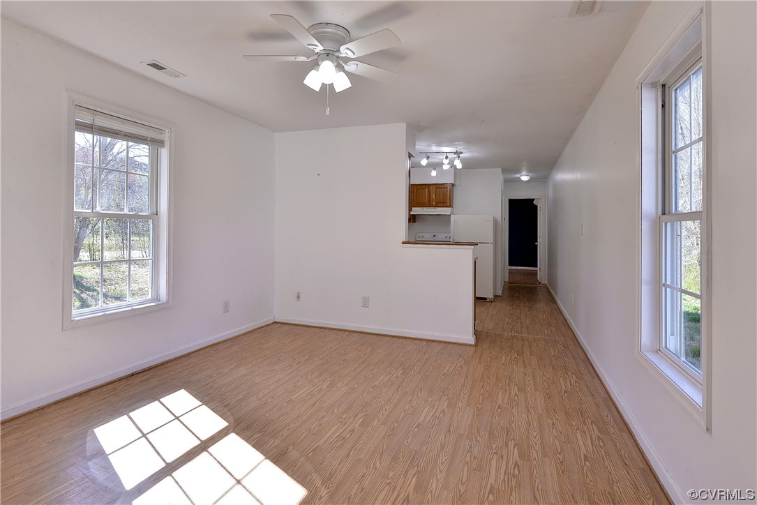 175 Racefield Drive Toano, VA 23168 - Photo 17 of 32 wooden floor in an empty room with a window