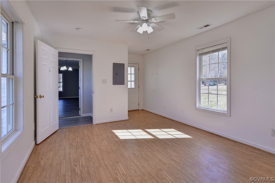 175 Racefield Drive Toano, VA 23168 - Photo 18 of 32 wooden floor in an empty room with a window