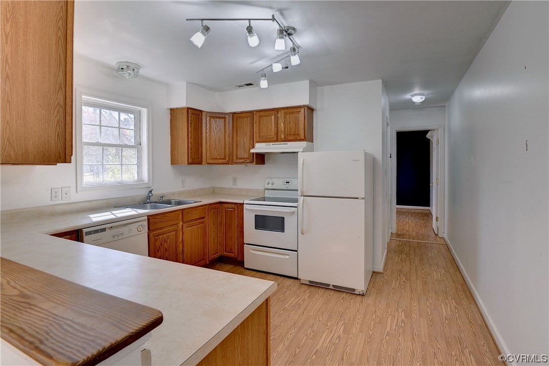 175 Racefield Drive Toano, VA 23168 - Photo 19 of 32 a kitchen with stainless steel appliances granite countertop a sink a stove a refrigerator cabinets and a wooden floor