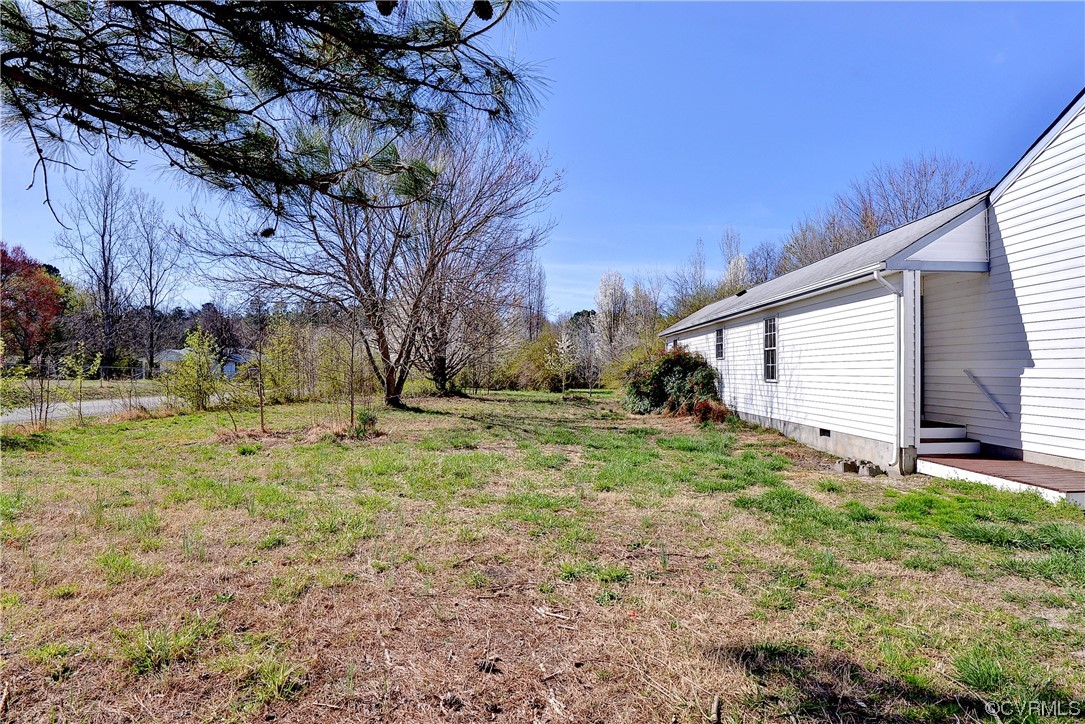 175 Racefield Drive Toano, VA 23168 - Photo 30 of 32 a view of a backyard with large trees