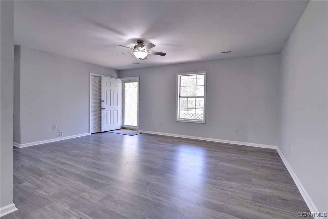 175 Racefield Drive Toano, VA 23168 - Photo 4 of 32 a view of an empty room with wooden floor and window