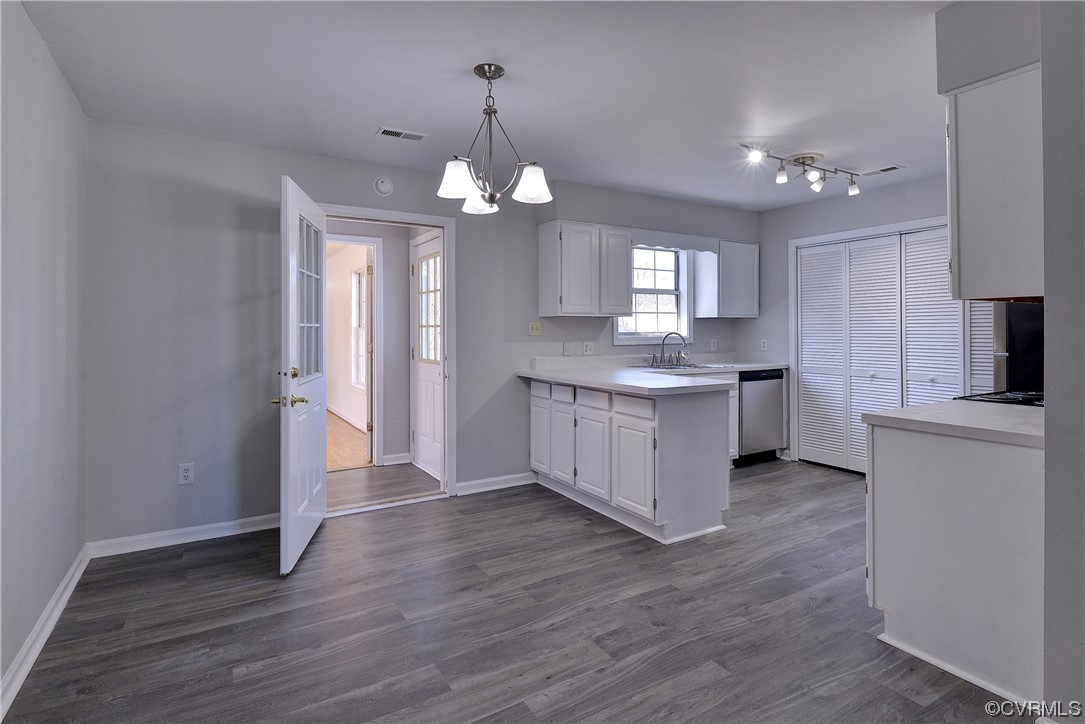 175 Racefield Drive Toano, VA 23168 - Photo 5 of 32 a large kitchen with granite countertop a large counter top space appliances and cabinets