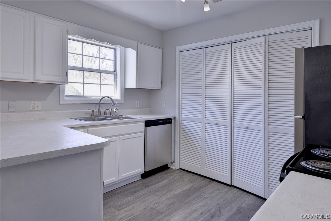175 Racefield Drive Toano, VA 23168 - Photo 8 of 32 a kitchen with a sink appliances cabinets and a window