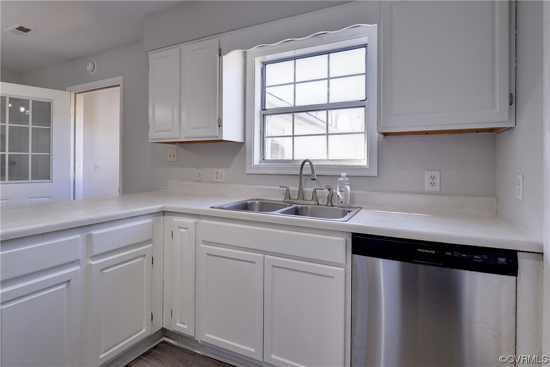 175 Racefield Drive Toano, VA 23168 - Photo 9 of 32 a kitchen with a sink cabinets and window