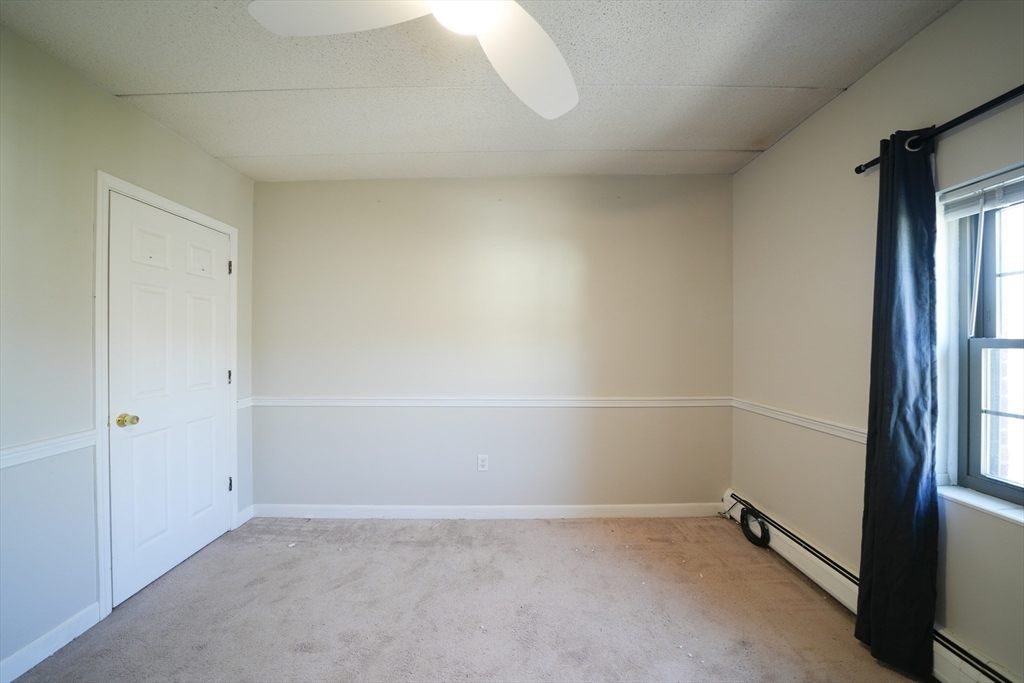 16 Winter Street, Unit 41A Waltham, MA 02451 - Photo 16 of 27 an empty room with a empty space and windows