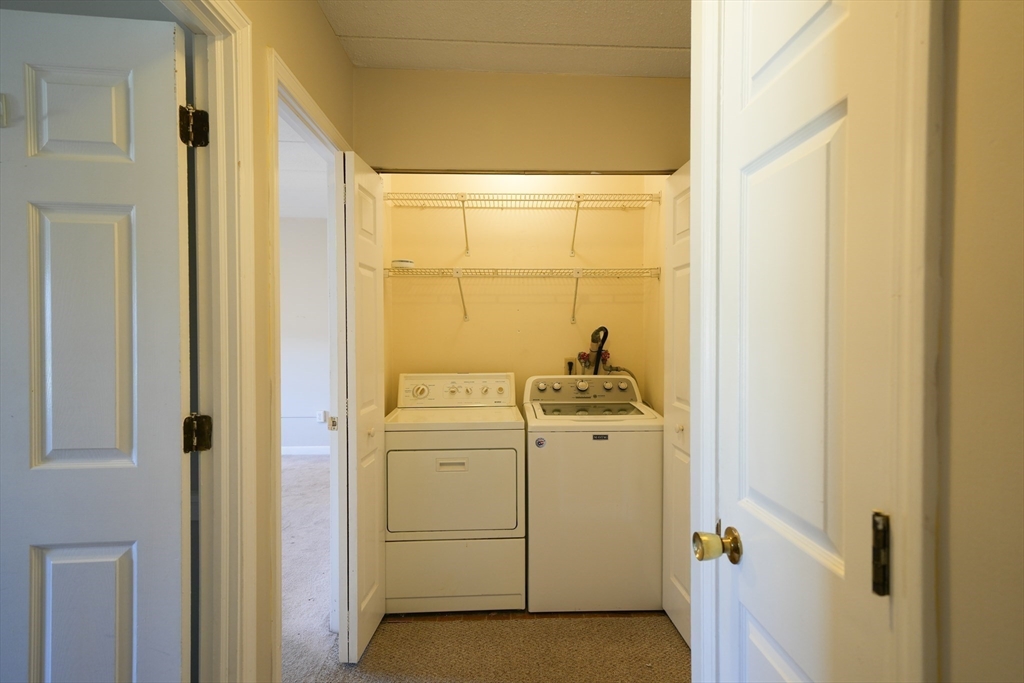 16 Winter Street, Unit 41A Waltham, MA 02451 - Photo 19 of 27 a utility room with dryer and washer
