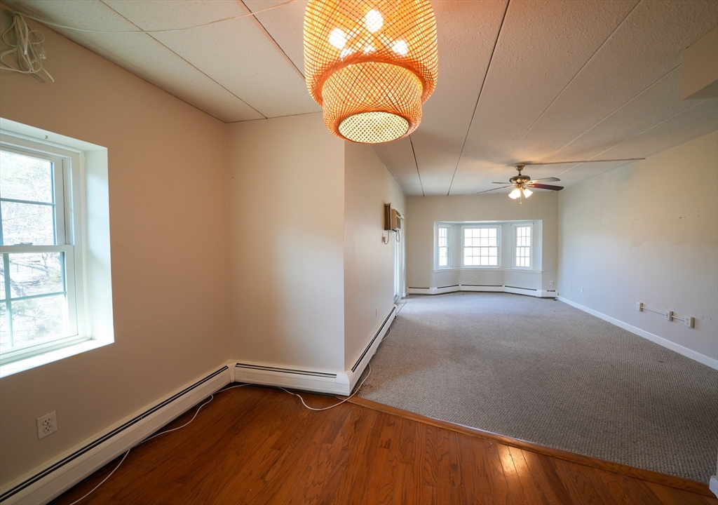 16 Winter Street, Unit 41A Waltham, MA 02451 - Photo 21 of 27 a view of a room with window and wooden floor