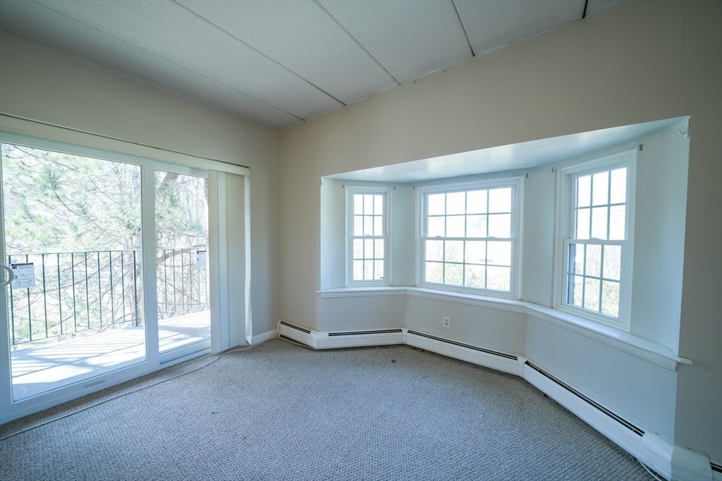 16 Winter Street, Unit 41A Waltham, MA 02451 - Photo 4 of 27 a view of an empty room with a window