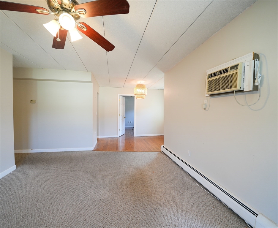 16 Winter Street, Unit 41A Waltham, MA 02451 - Photo 7 of 27 a view of a livingroom with a ceiling fan