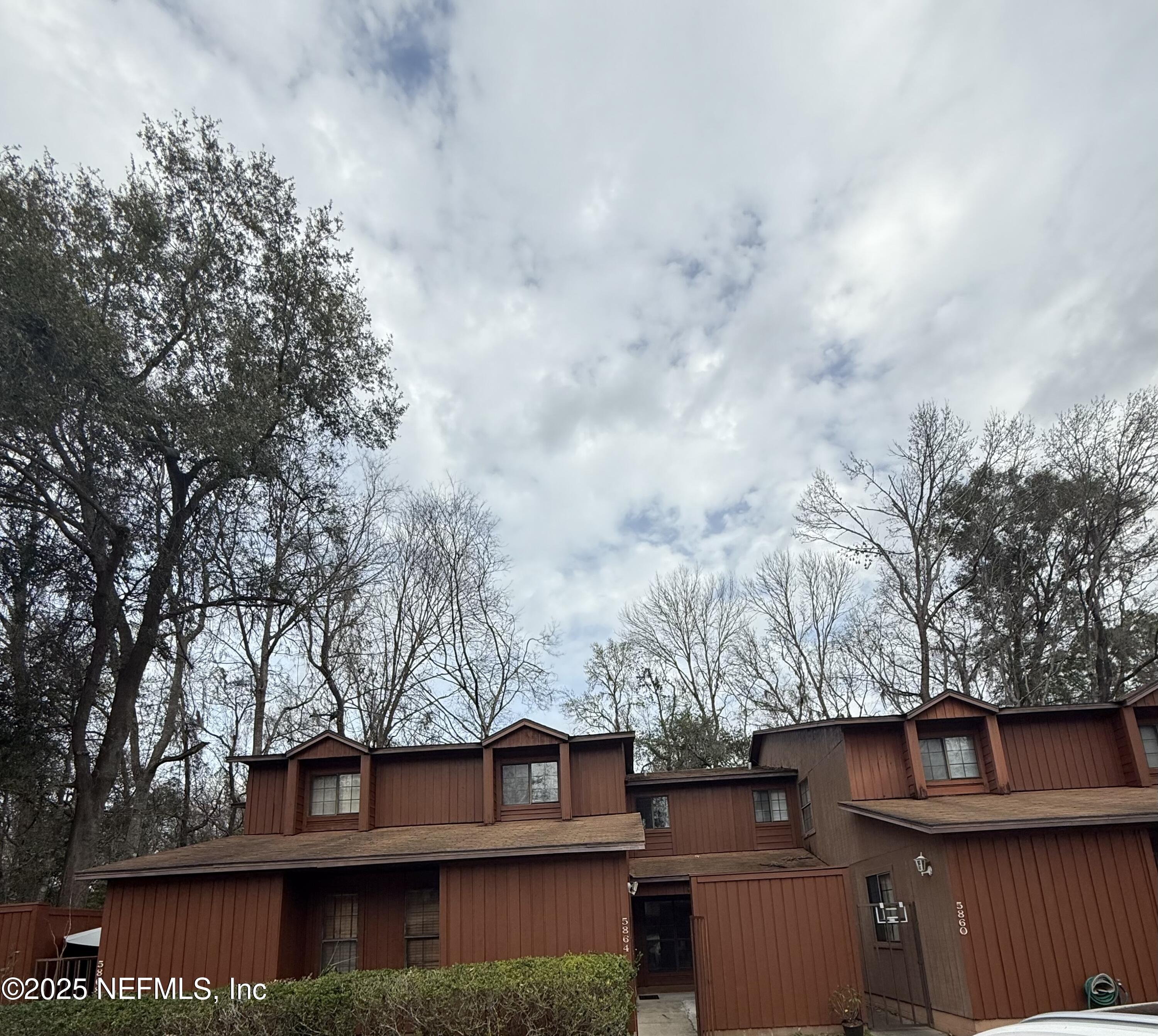 5864 Southwest 8th Place Gainesville, FL 32607 - Photo 2 of 8 a view of a house with a large tree