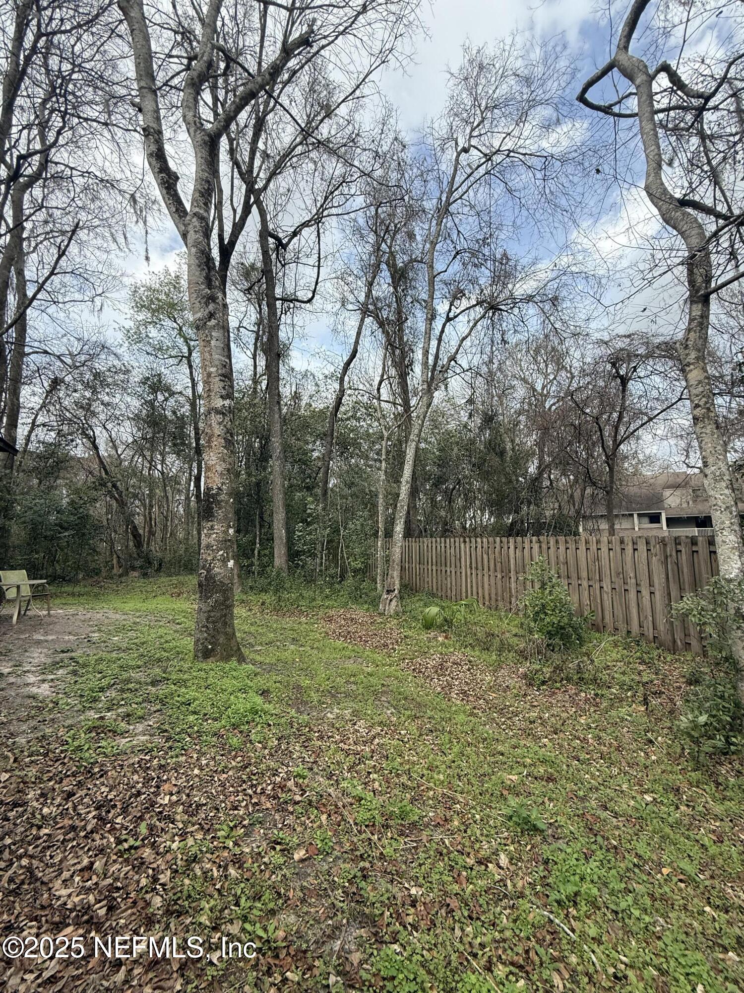 5864 Southwest 8th Place Gainesville, FL 32607 - Photo 7 of 8 a backyard of a house with lots of green space