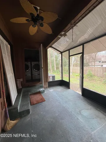 a view of an empty room with a fireplace