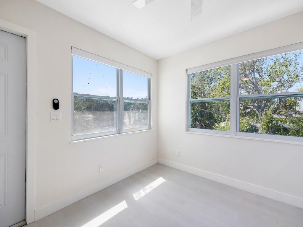 741 Hernando Street Fort Pierce, FL 34949 - Photo 13 of 65 a view of an empty room with a window