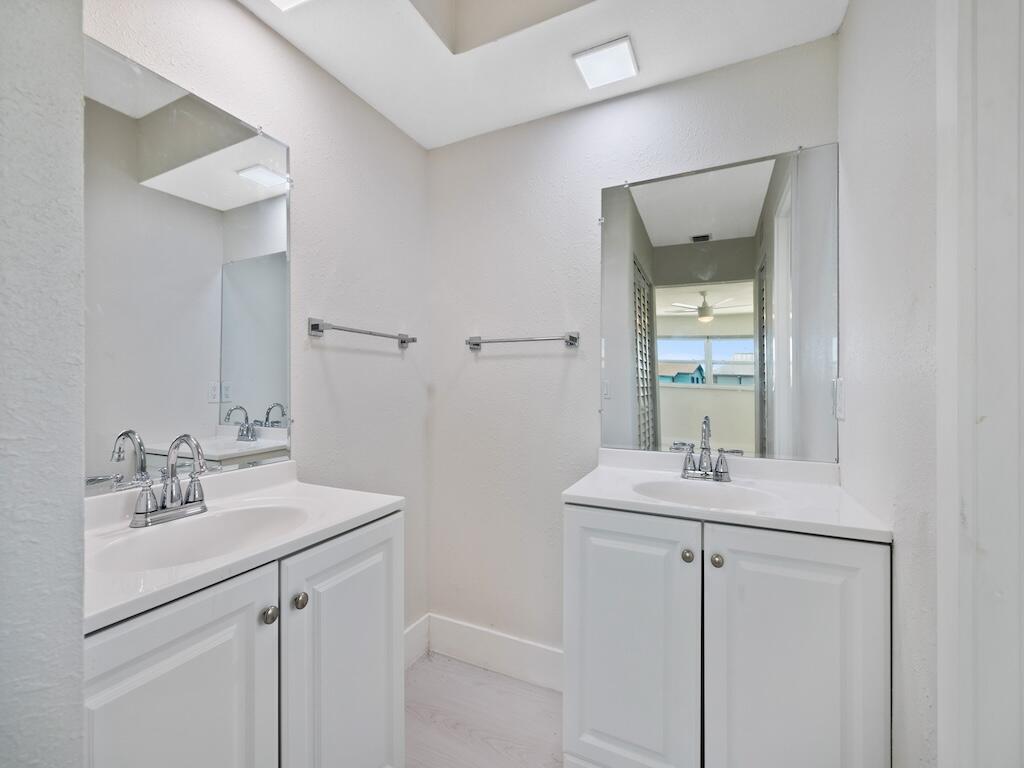 741 Hernando Street Fort Pierce, FL 34949 - Photo 23 of 65 a bathroom with a sink and a mirror