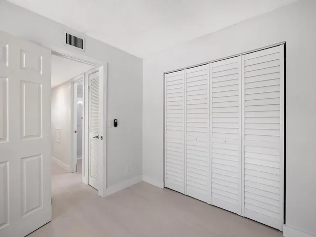 a picture of a wall with a white building