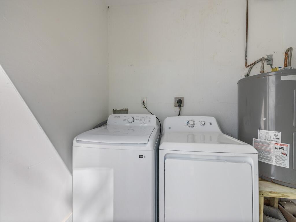 741 Hernando Street Fort Pierce, FL 34949 - Photo 57 of 65 a utility room with dryer and washer