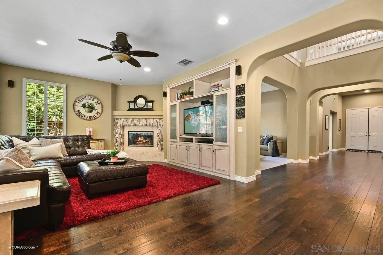 16658 Deer Ridge Road San Diego, CA 92127 - Photo 13 of 44 a living room with furniture fireplace and flat screen tv