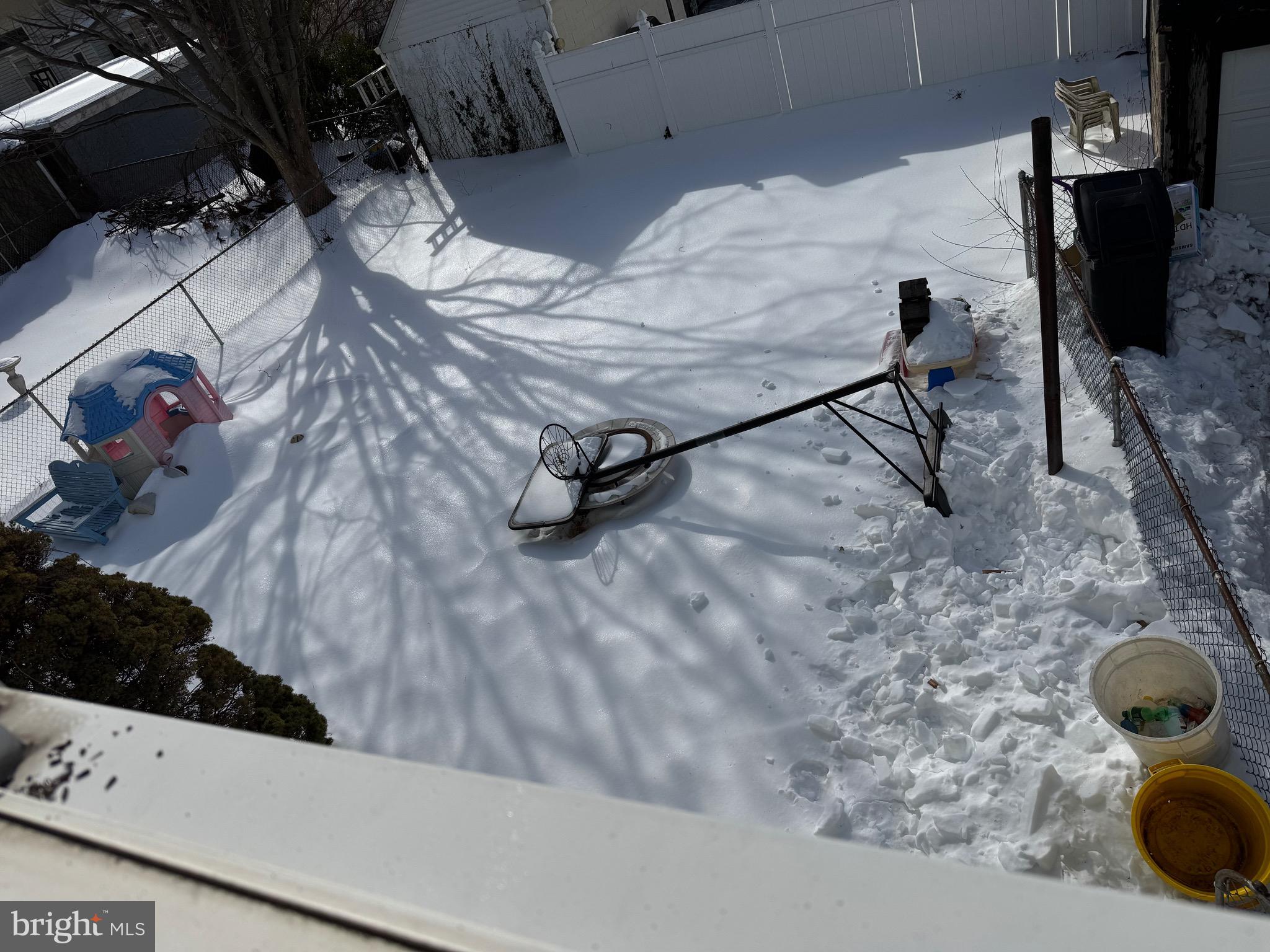 226 Lynbrooke Road Springfield, PA 19064 - Photo 17 of 25 a room with water heater and wooden cabinets