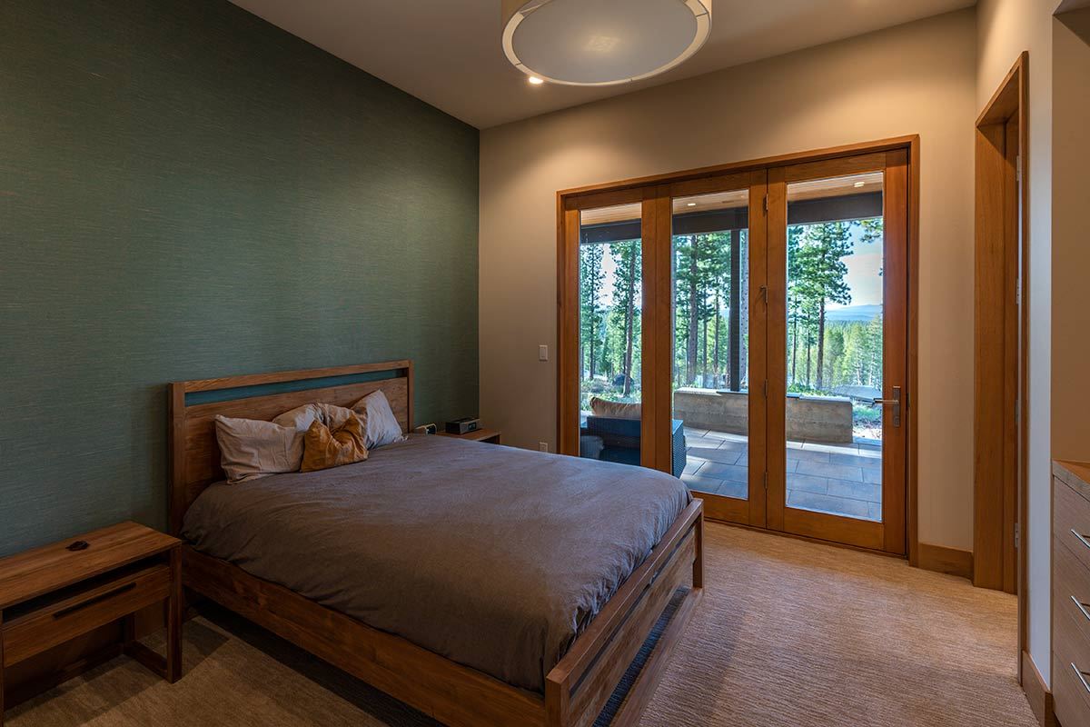 8237 Ehrman Drive Truckee, CA 96161 - Photo 17 of 21 a bed sitting in a bedroom next to a window