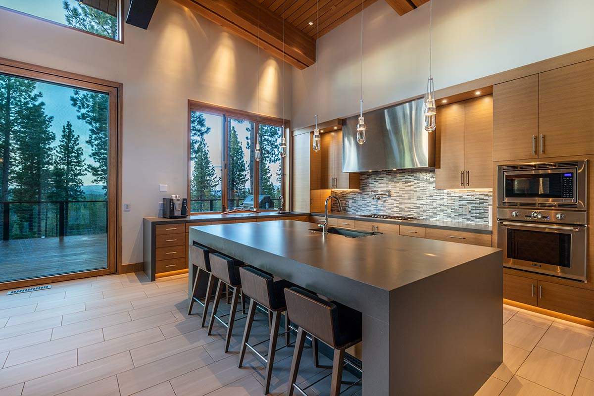 8237 Ehrman Drive Truckee, CA 96161 - Photo 7 of 21 a kitchen with stainless steel appliances granite countertop a stove a sink and a refrigerator