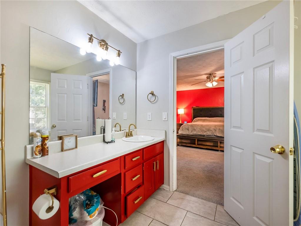 443 Rhett Drive Loganville, GA 30052 - Photo 18 of 28 a en suite bathroom with a sink double vanity and a mirror