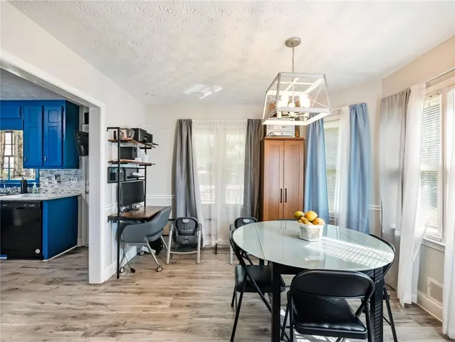 a view of a dining room with furniture and window