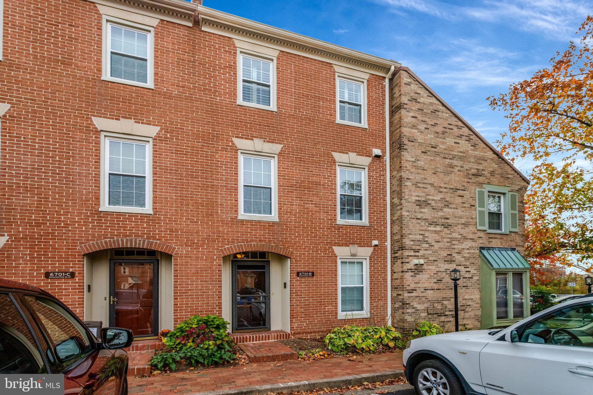 6701 Washington Boulevard, Unit B Arlington, VA 22205 - Photo 1 of 20 a front view of a house with a yard