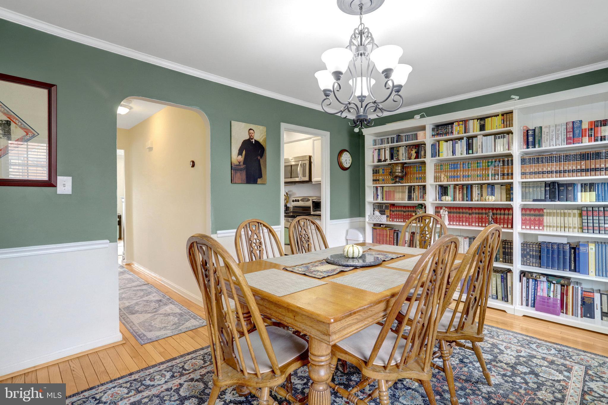 6701 Washington Boulevard, Unit B Arlington, VA 22205 - Photo 13 of 20 a view of a dining room with furniture and a bookshelf