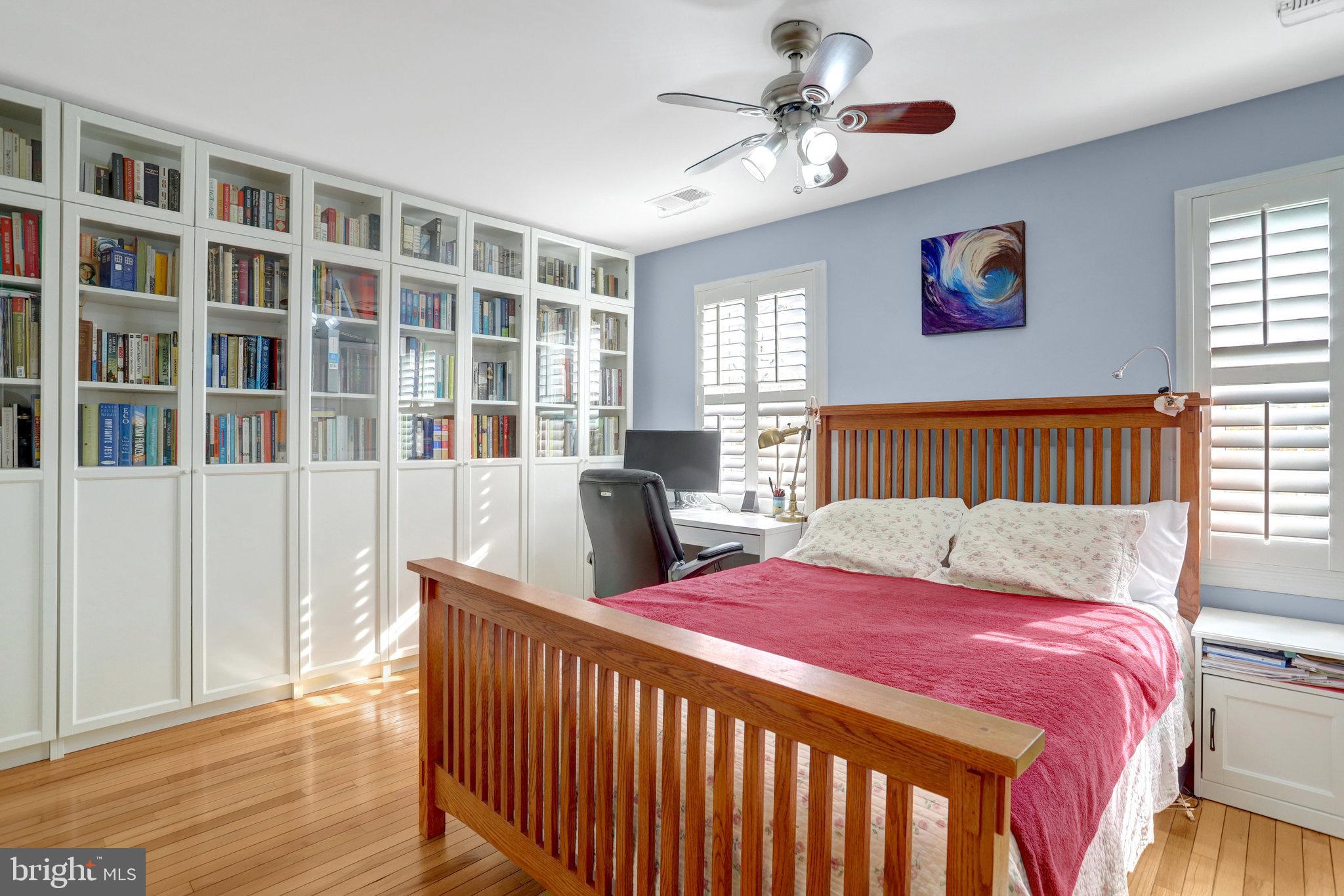 6701 Washington Boulevard, Unit B Arlington, VA 22205 - Photo 15 of 20 a bedroom with bed and wooden floor