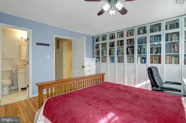 a bedroom with furniture and a window