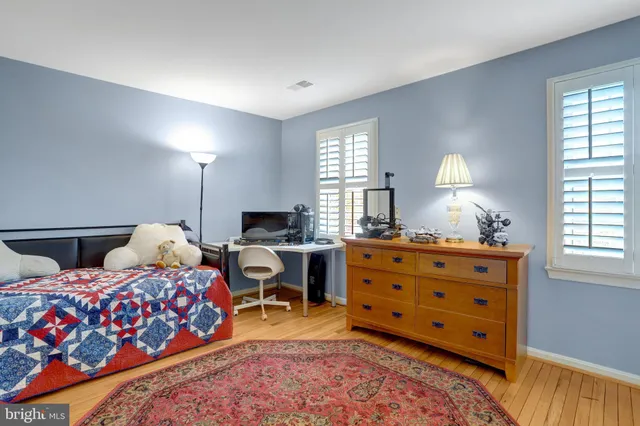 a bed room with two beds and a window