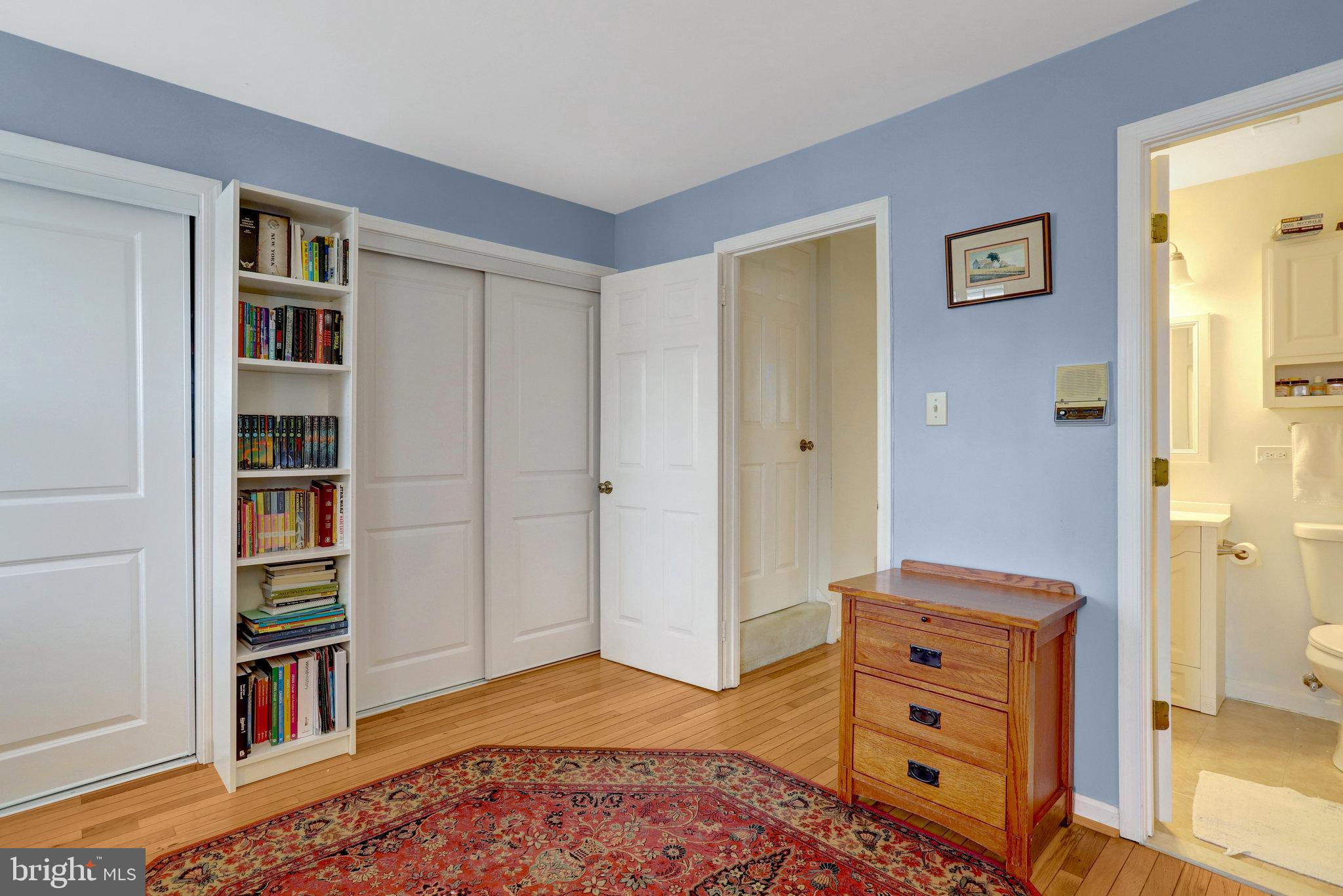 6701 Washington Boulevard, Unit B Arlington, VA 22205 - Photo 19 of 20 a bedroom with furniture and a book shelf