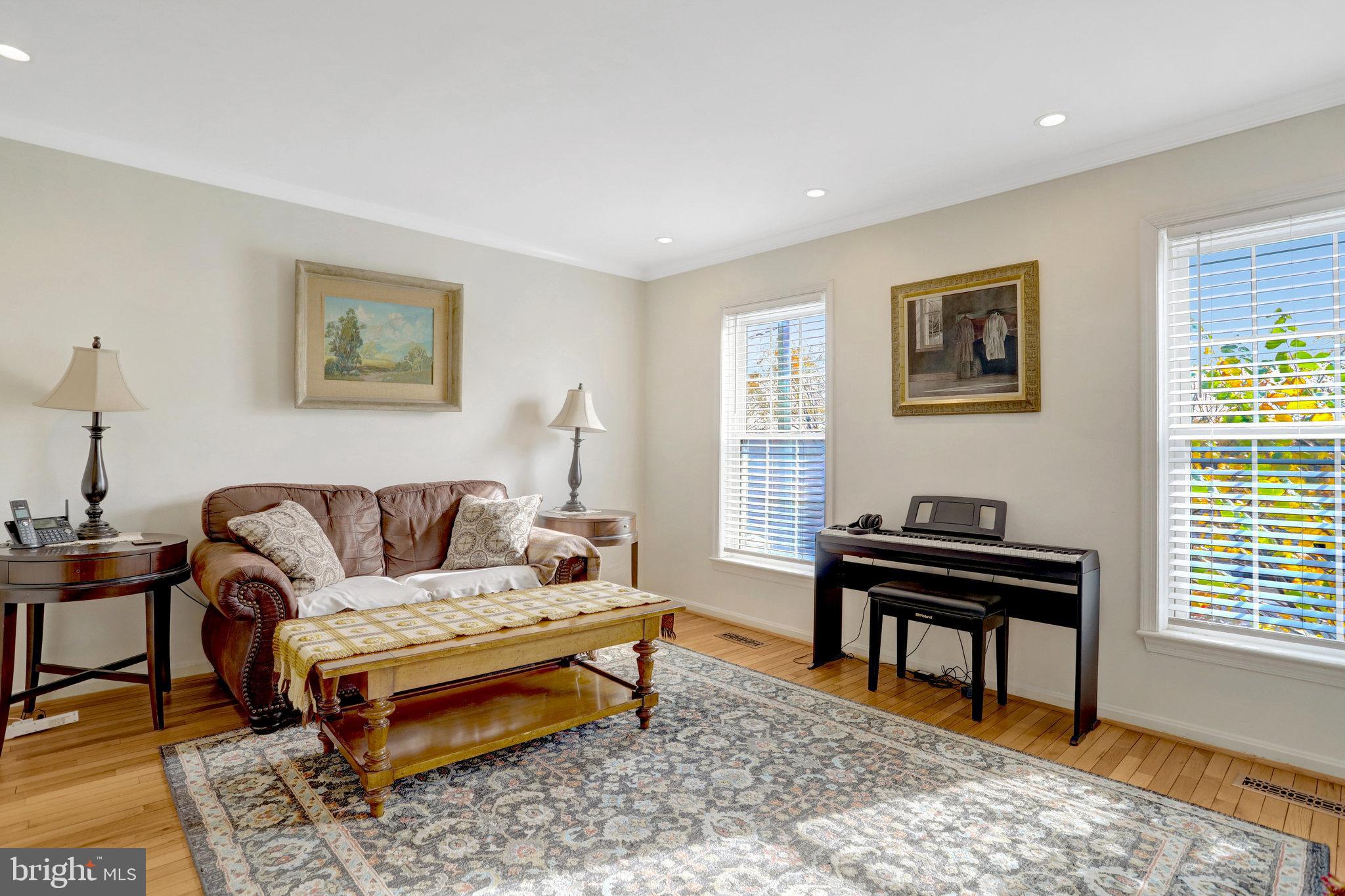 6701 Washington Boulevard, Unit B Arlington, VA 22205 - Photo 5 of 20 a living room with furniture a rug and a window