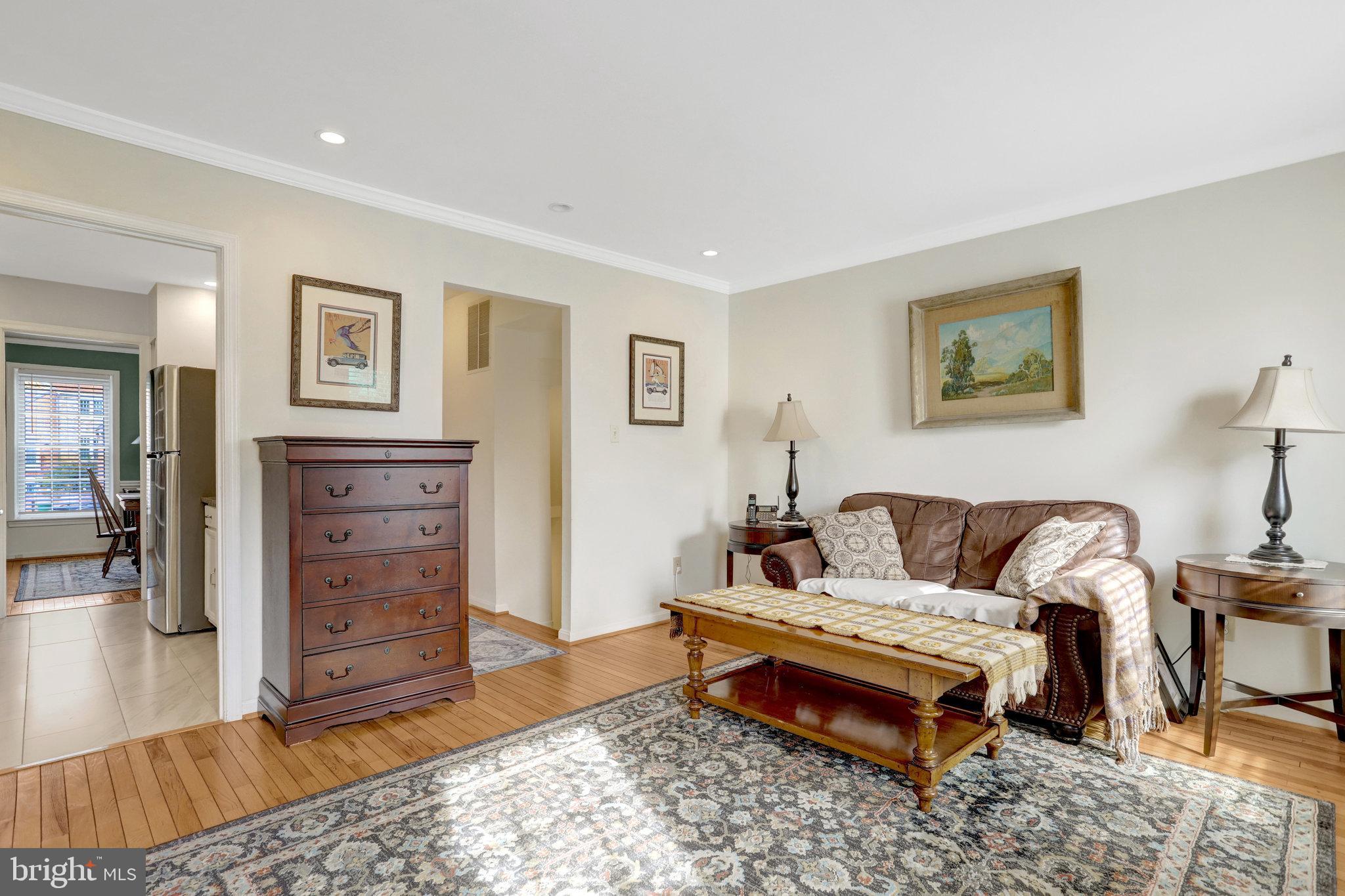 6701 Washington Boulevard, Unit B Arlington, VA 22205 - Photo 7 of 20 a living room with furniture and wooden floor