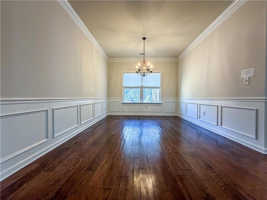 261 Potomac Drive Dallas, GA 30132 - Photo 16 of 76 wooden floor in an empty room with a window