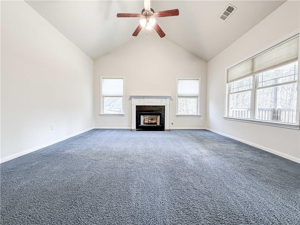 261 Potomac Drive Dallas, GA 30132 - Photo 18 of 76 a view of empty room with fireplace and windows