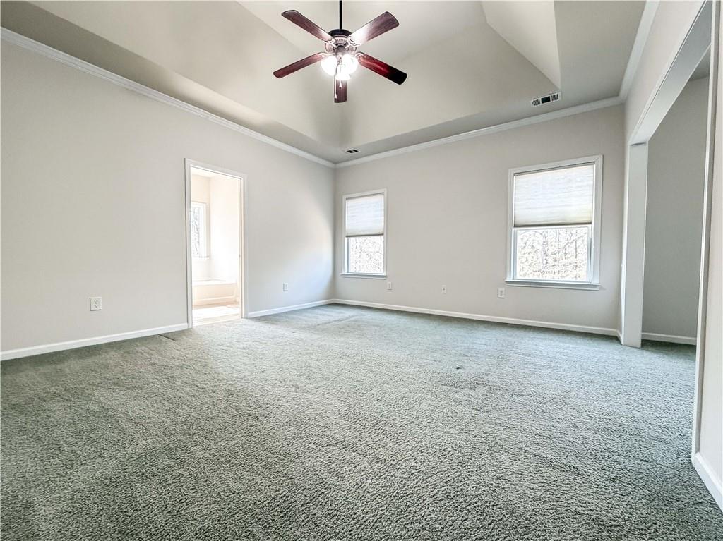 261 Potomac Drive Dallas, GA 30132 - Photo 29 of 76 a view of an empty room and window ceiling fan