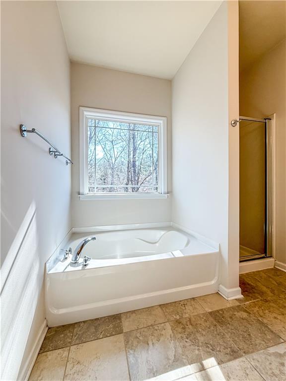 261 Potomac Drive Dallas, GA 30132 - Photo 35 of 76 a spacious bathroom with bathtub and shower