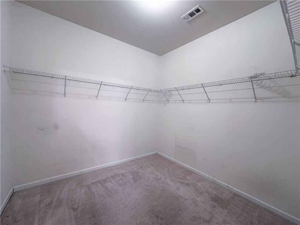 261 Potomac Drive Dallas, GA 30132 - Photo 36 of 76 a view of a room with racks on the wall