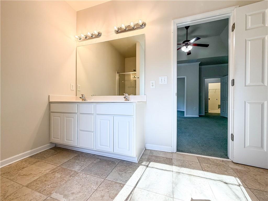 261 Potomac Drive Dallas, GA 30132 - Photo 37 of 76 a view of a bathroom with mirror and sink