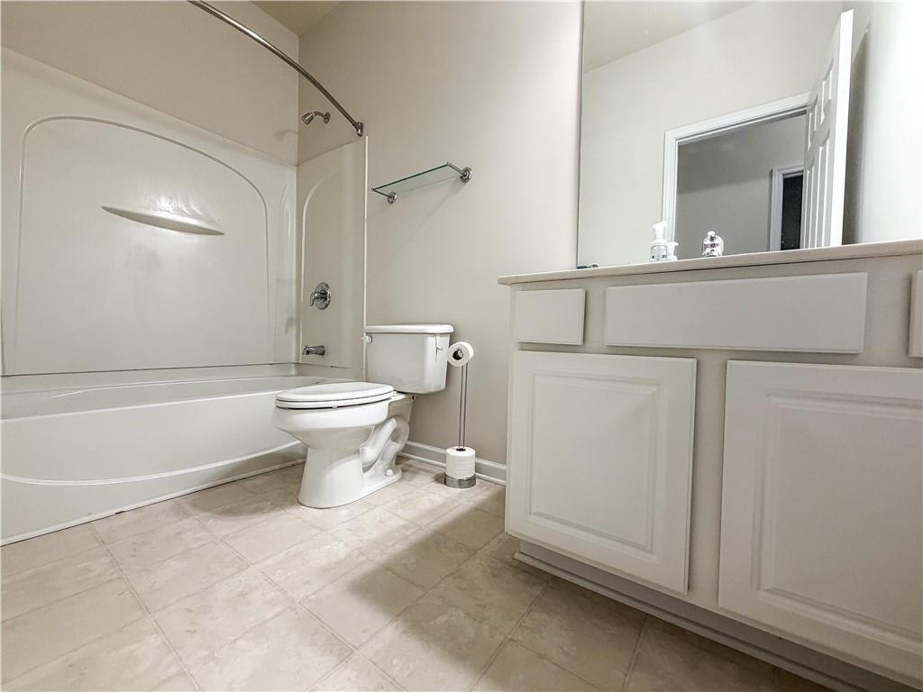 261 Potomac Drive Dallas, GA 30132 - Photo 42 of 76 a bathroom with a toilet sink and mirror