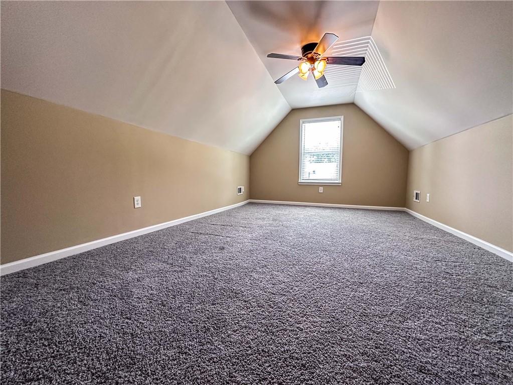 261 Potomac Drive Dallas, GA 30132 - Photo 47 of 76 a view of a room with a ceiling fan and a window
