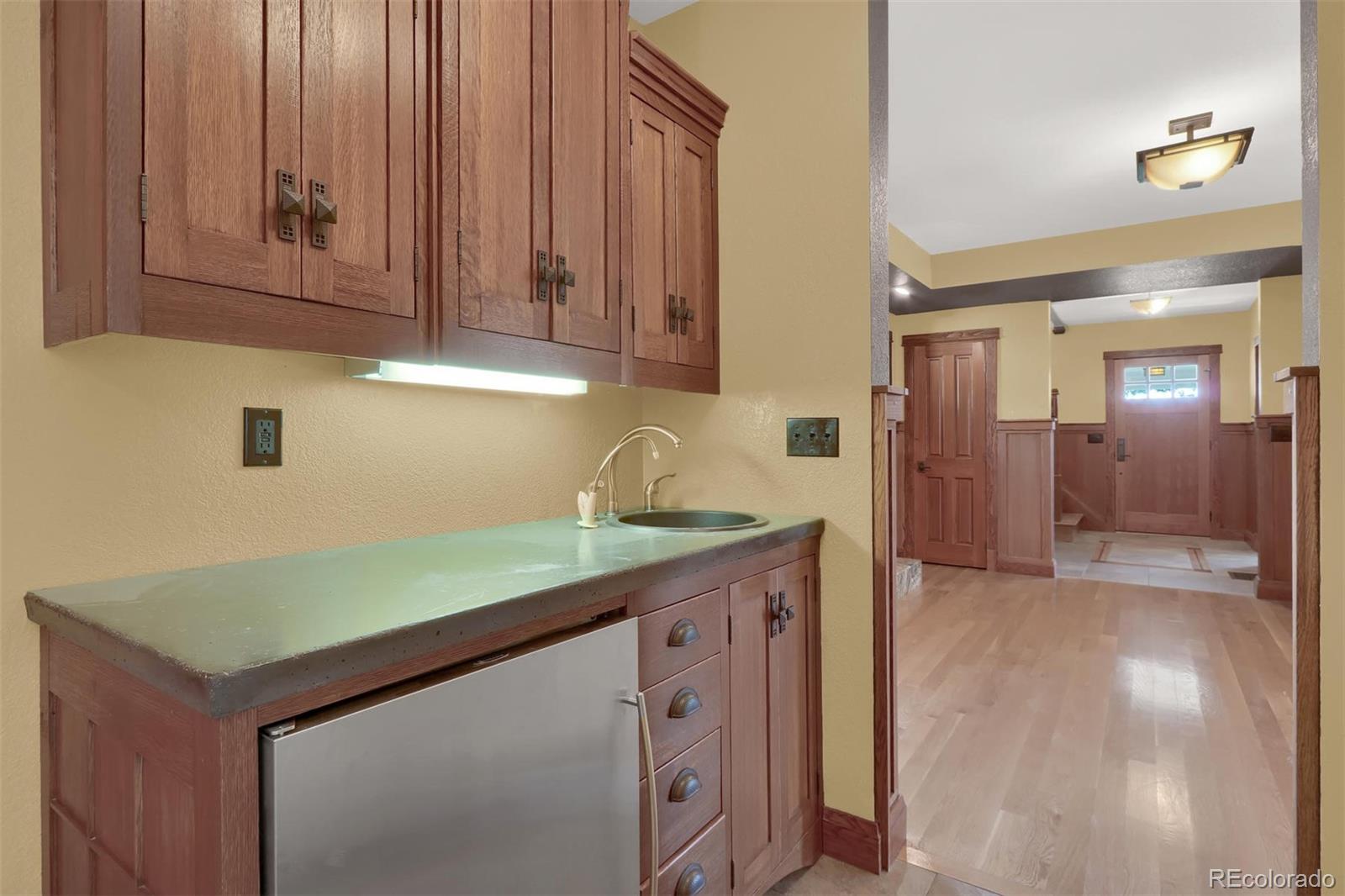 3045 Hay Creek Road Colorado Springs, CO 80921 - Photo 13 of 40 a kitchen with a sink and cabinets