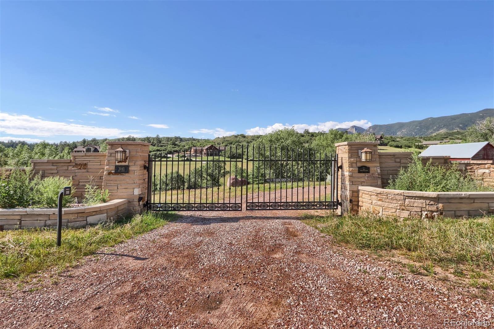3045 Hay Creek Road Colorado Springs, CO 80921 - Photo 2 of 40 a view of a garden from a balcony