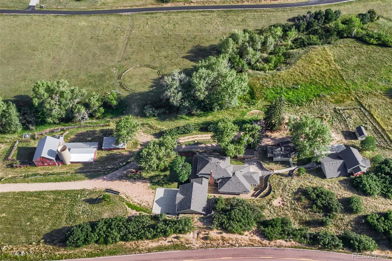 3045 Hay Creek Road Colorado Springs, CO 80921 - Photo 39 of 40 an aerial view of a house with a yard