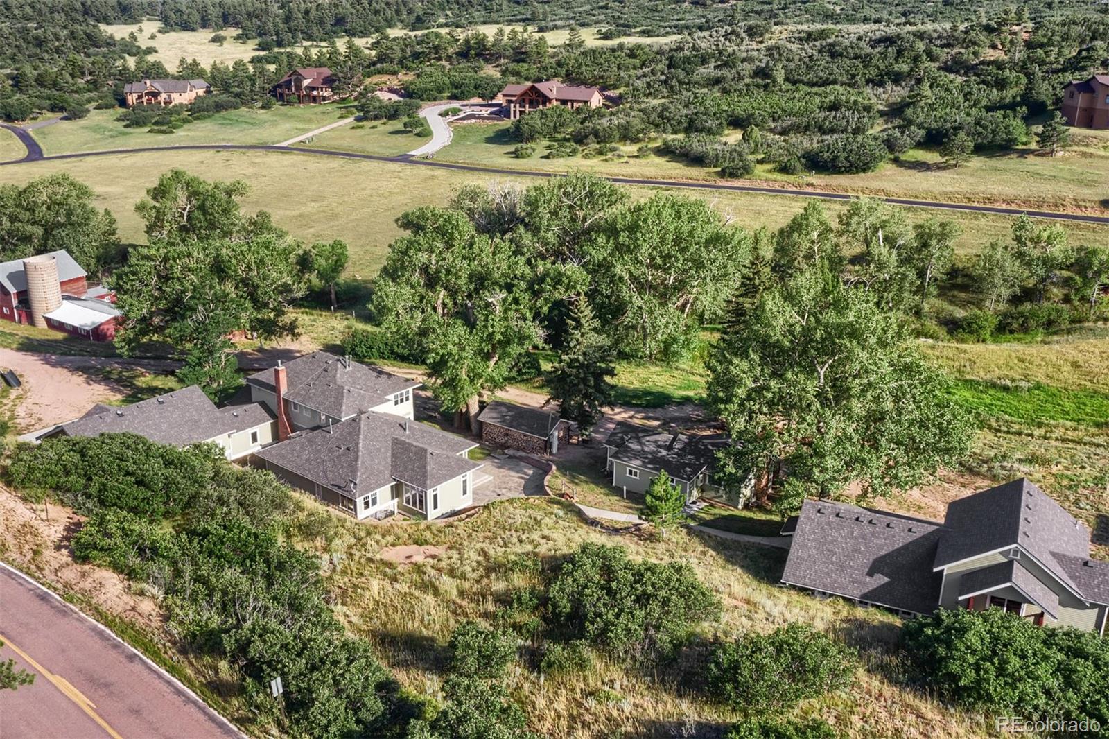 3045 Hay Creek Road Colorado Springs, CO 80921 - Photo 40 of 40 an aerial view of a house with a yard and lake view