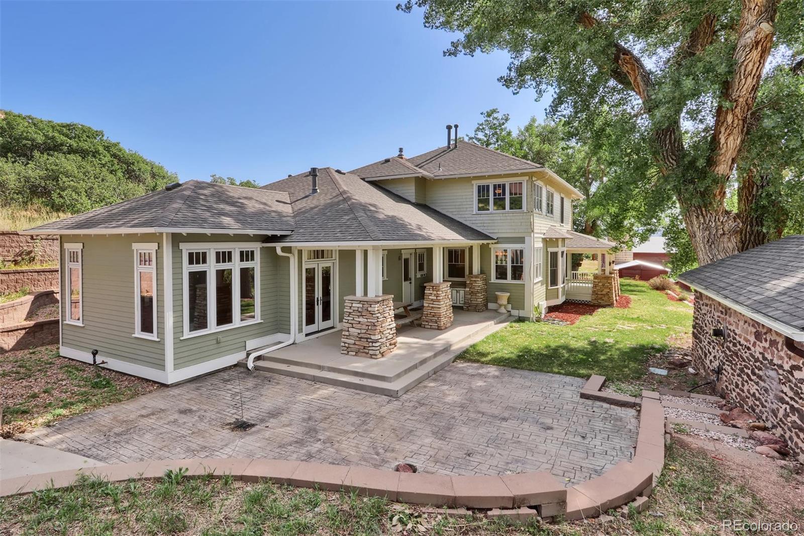 3045 Hay Creek Road Colorado Springs, CO 80921 - Photo 6 of 40 front view of a house with a yard