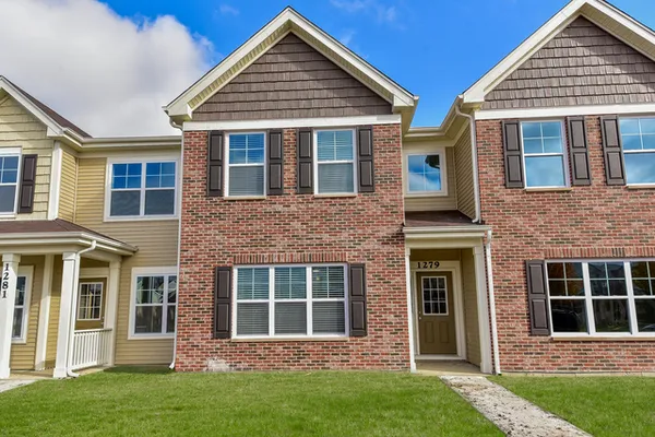 front view of a house with a yard